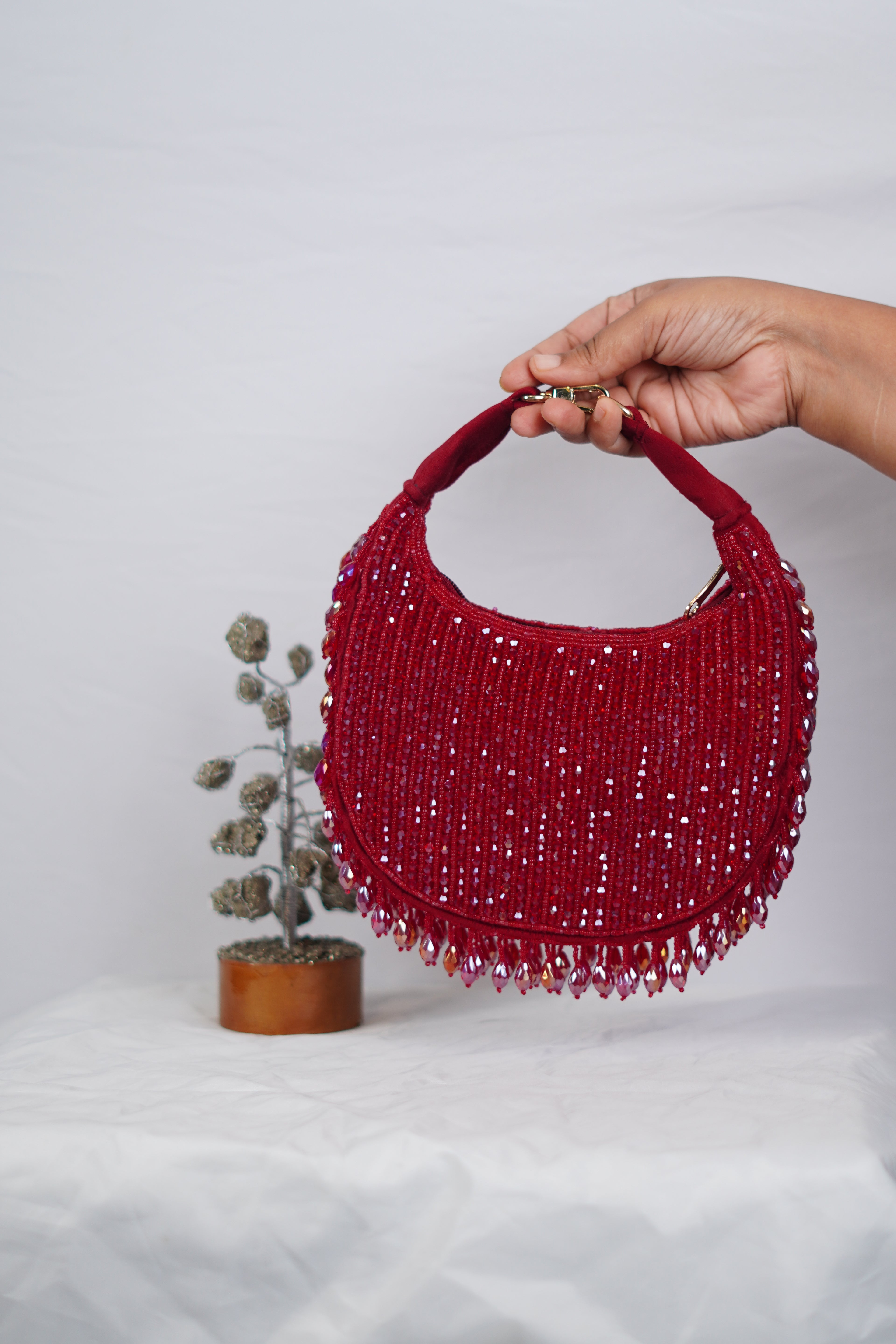 Red beaded party bag with tassels
