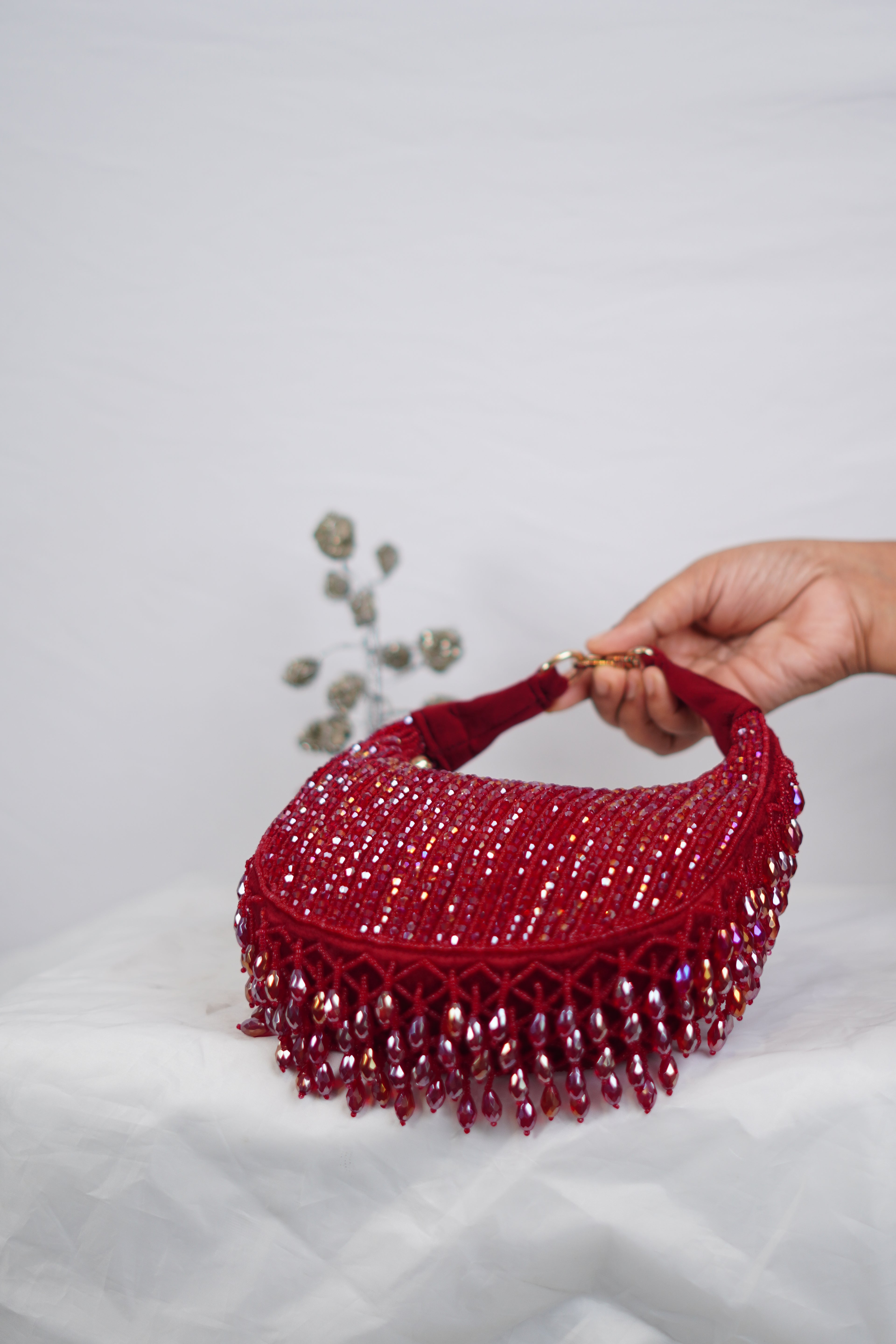 Red beaded party bag with tassels