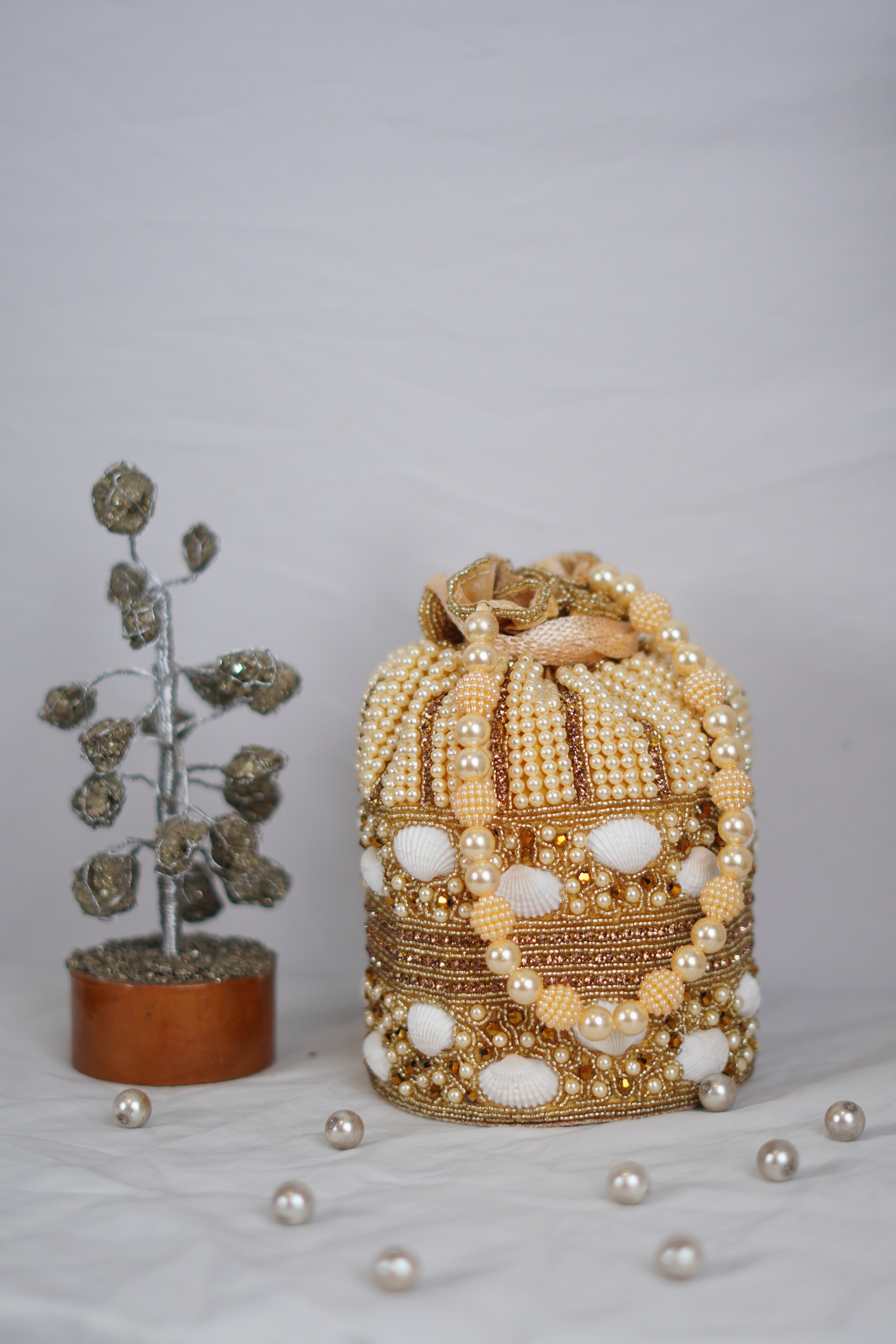 Shell work golden Potli