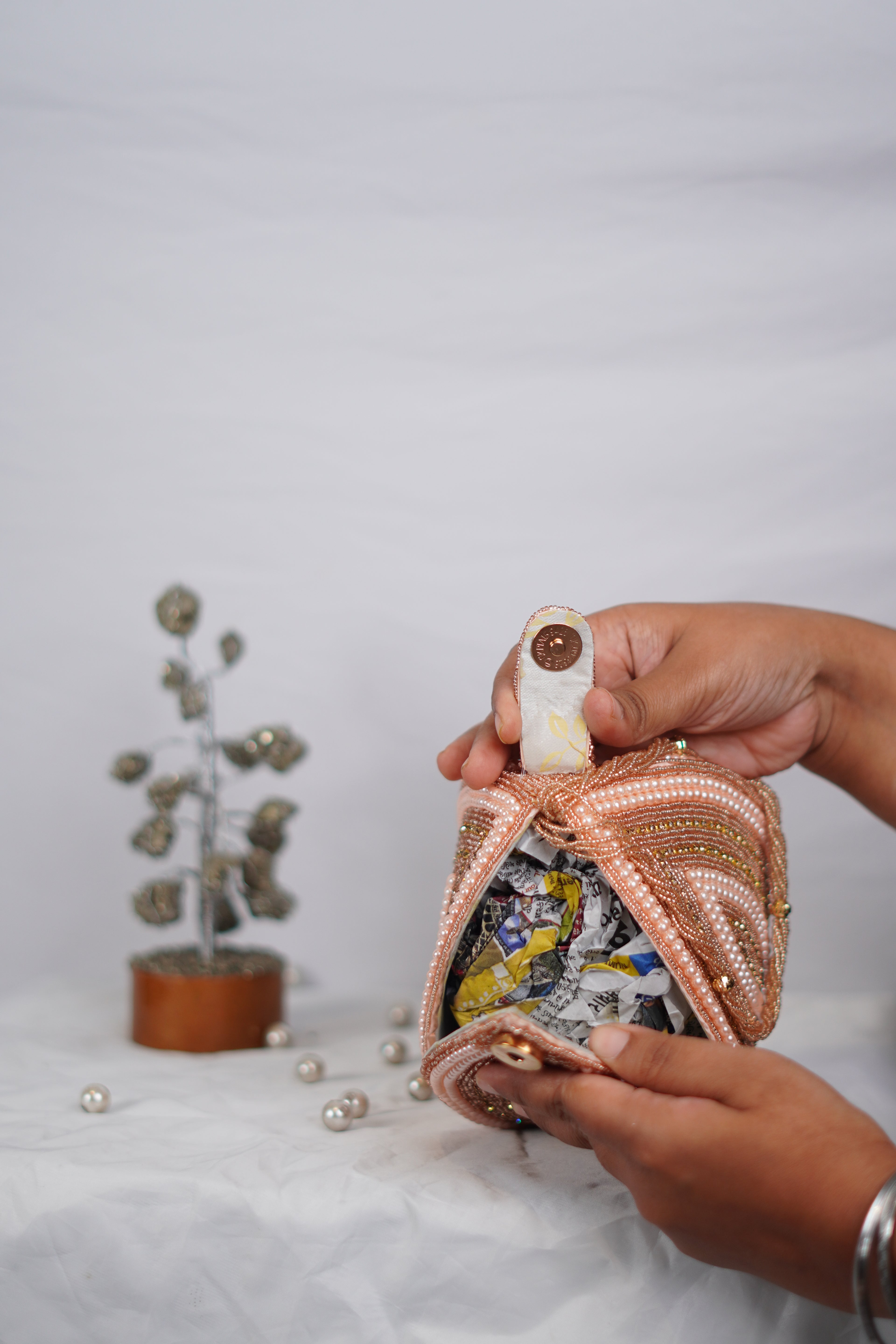 Handcrafted Coconut-Shaped Beaded Wristlet Potli
