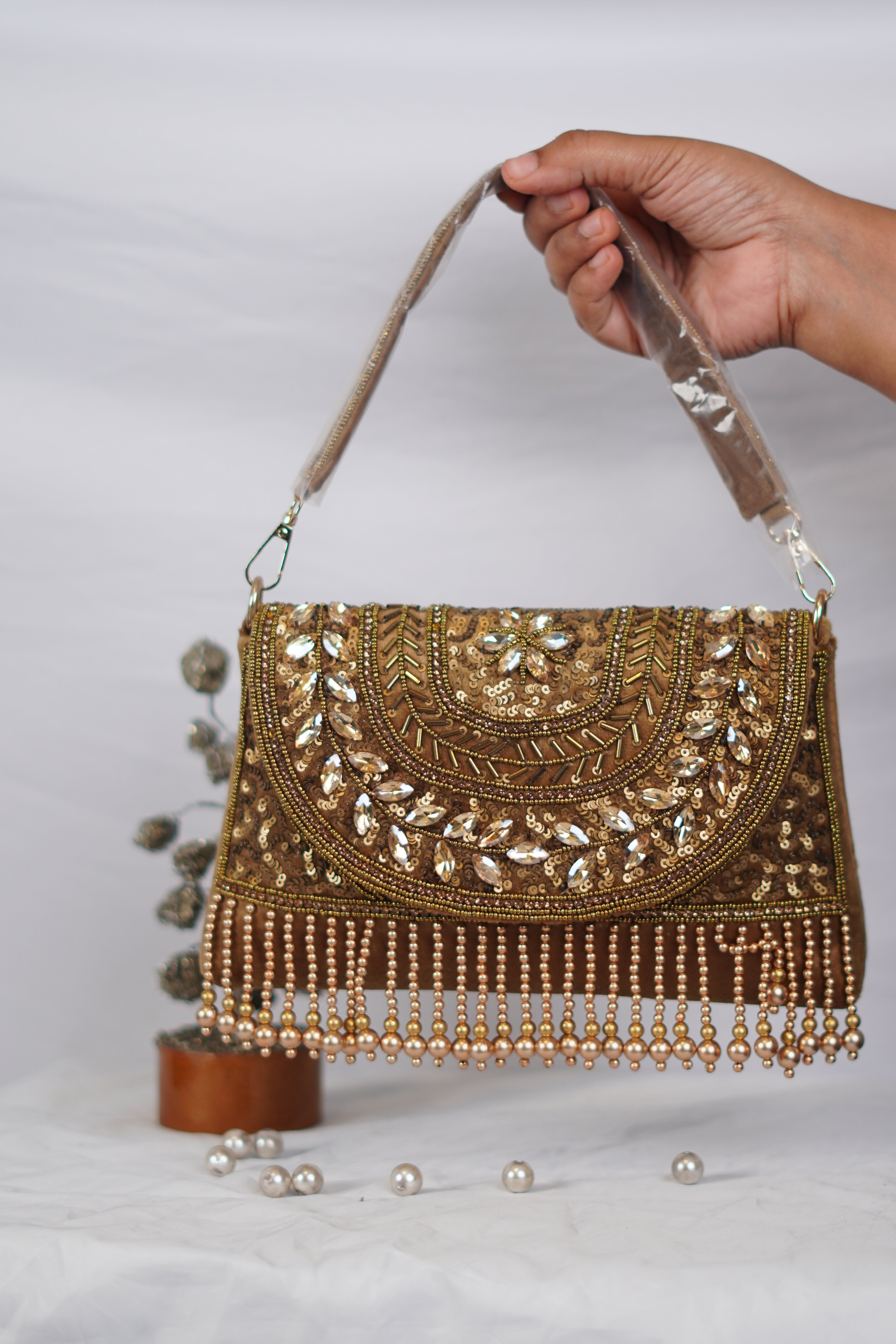 Embellished handbag with beaded tassels