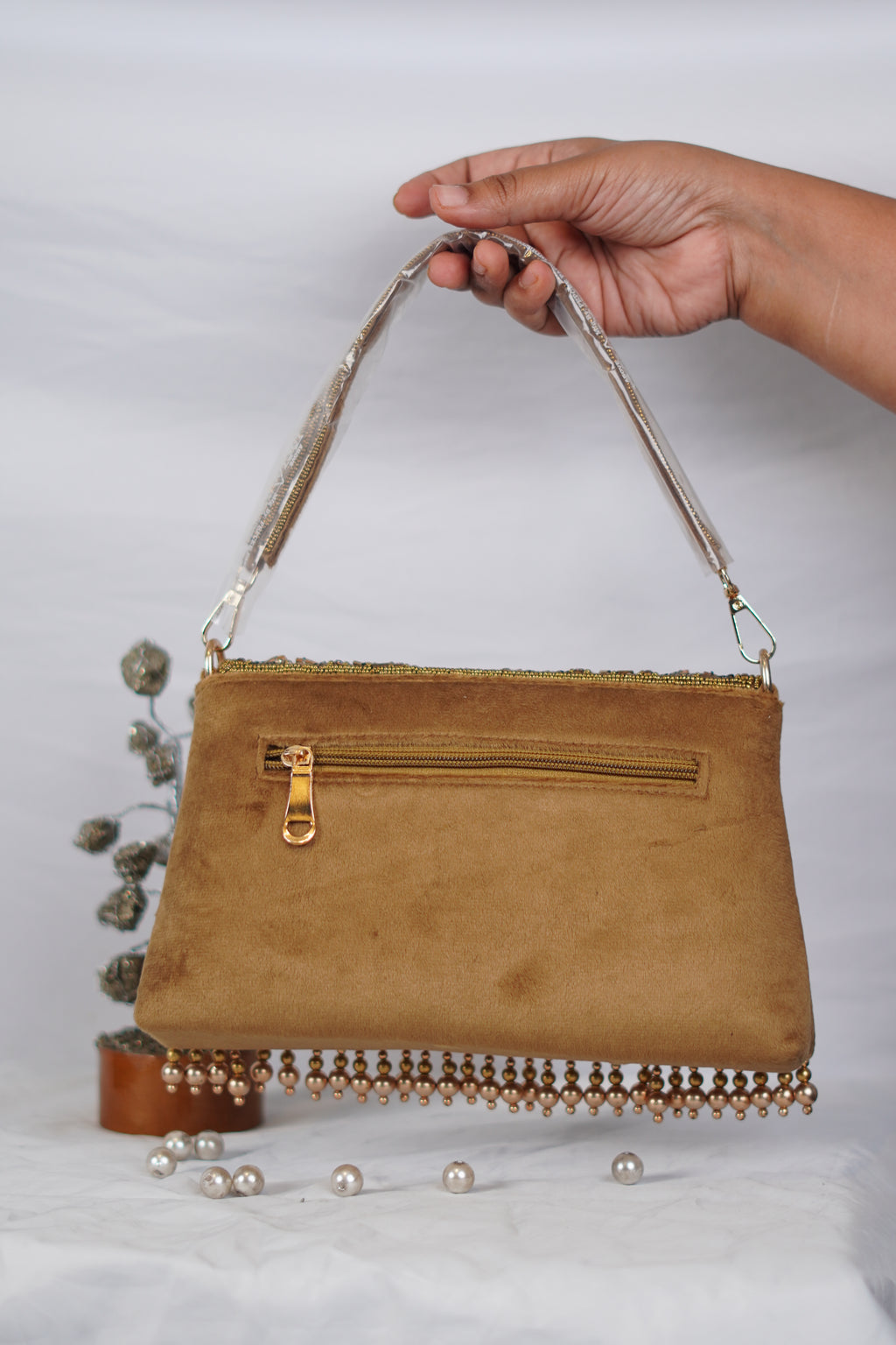 Embellished handbag with beaded tassels