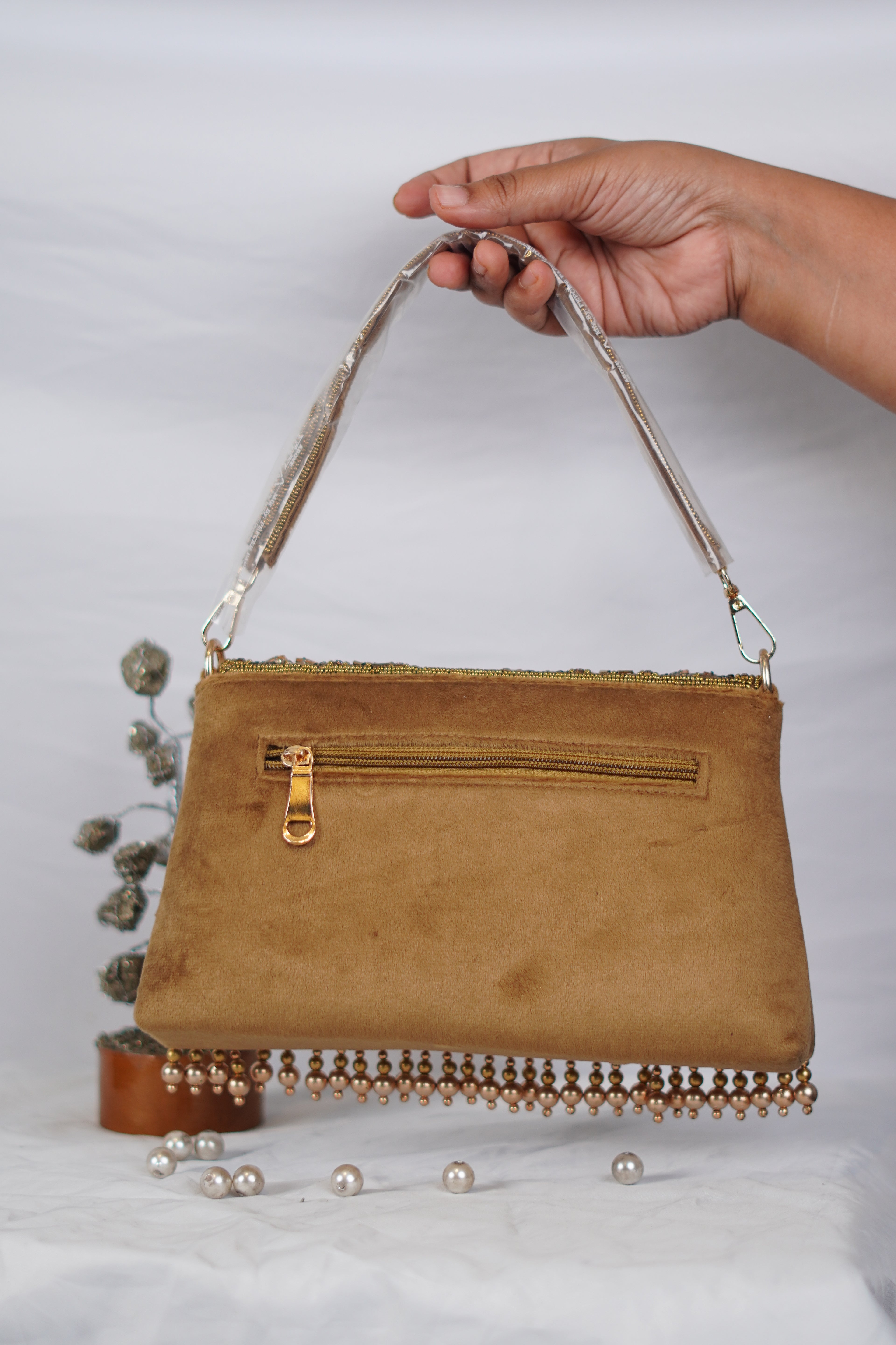 Embellished handbag with beaded tassels