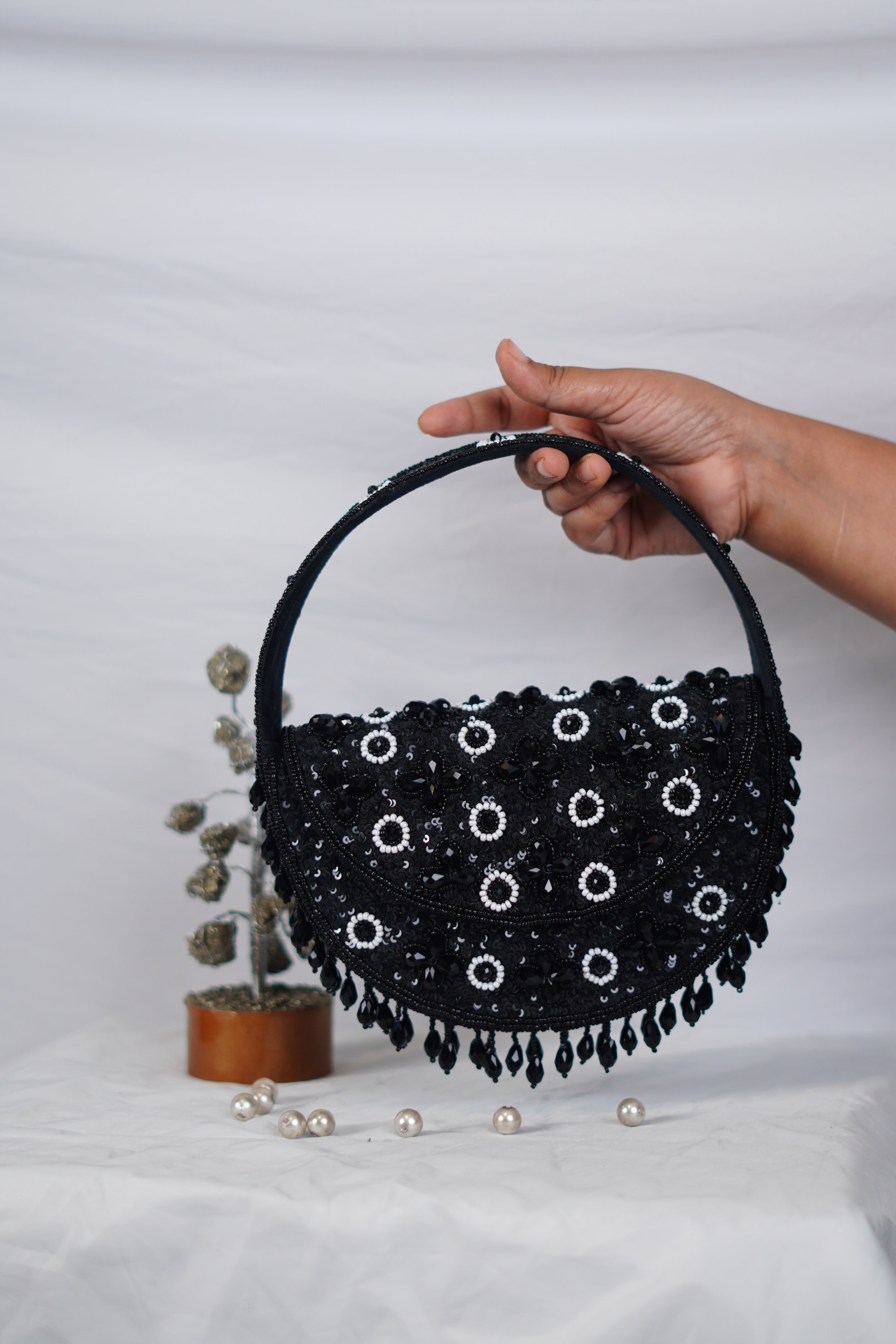 Embellished handbag with beaded tassels