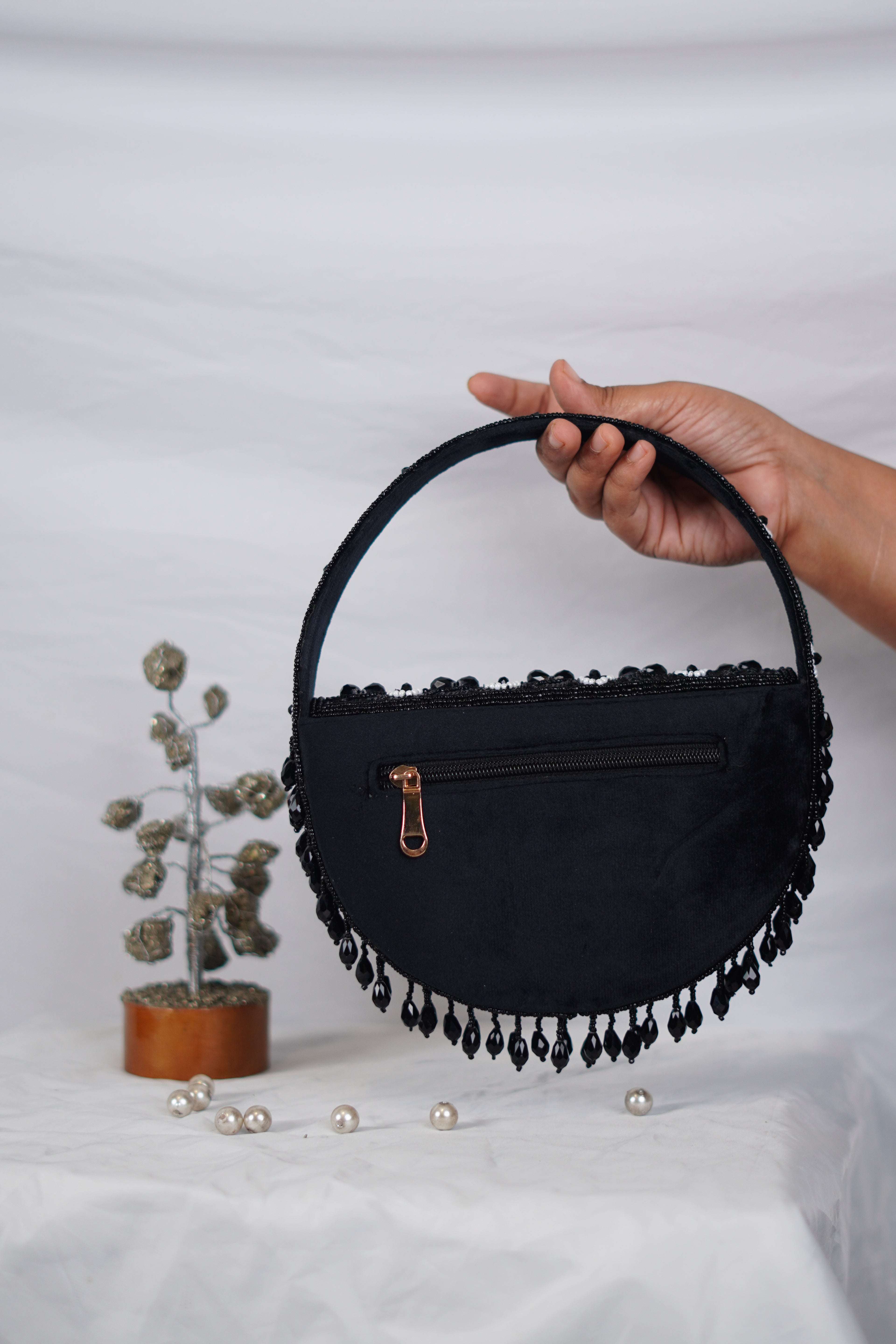 Embellished handbag with beaded tassels