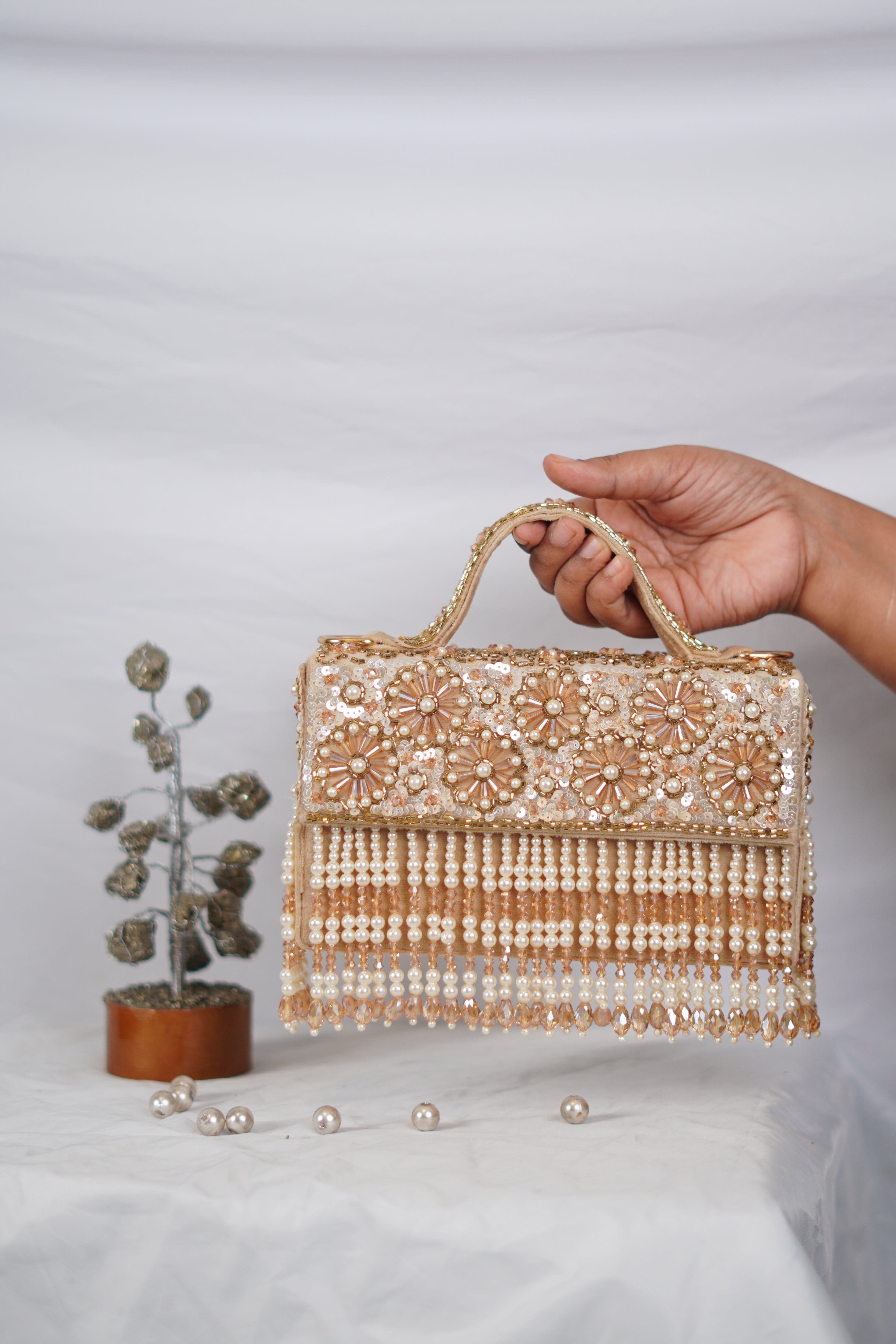 Partywear handbag with beaded tassels