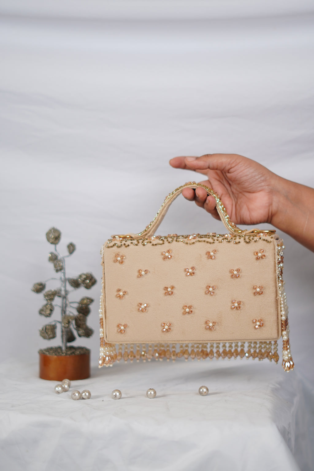 Partywear handbag with beaded tassels