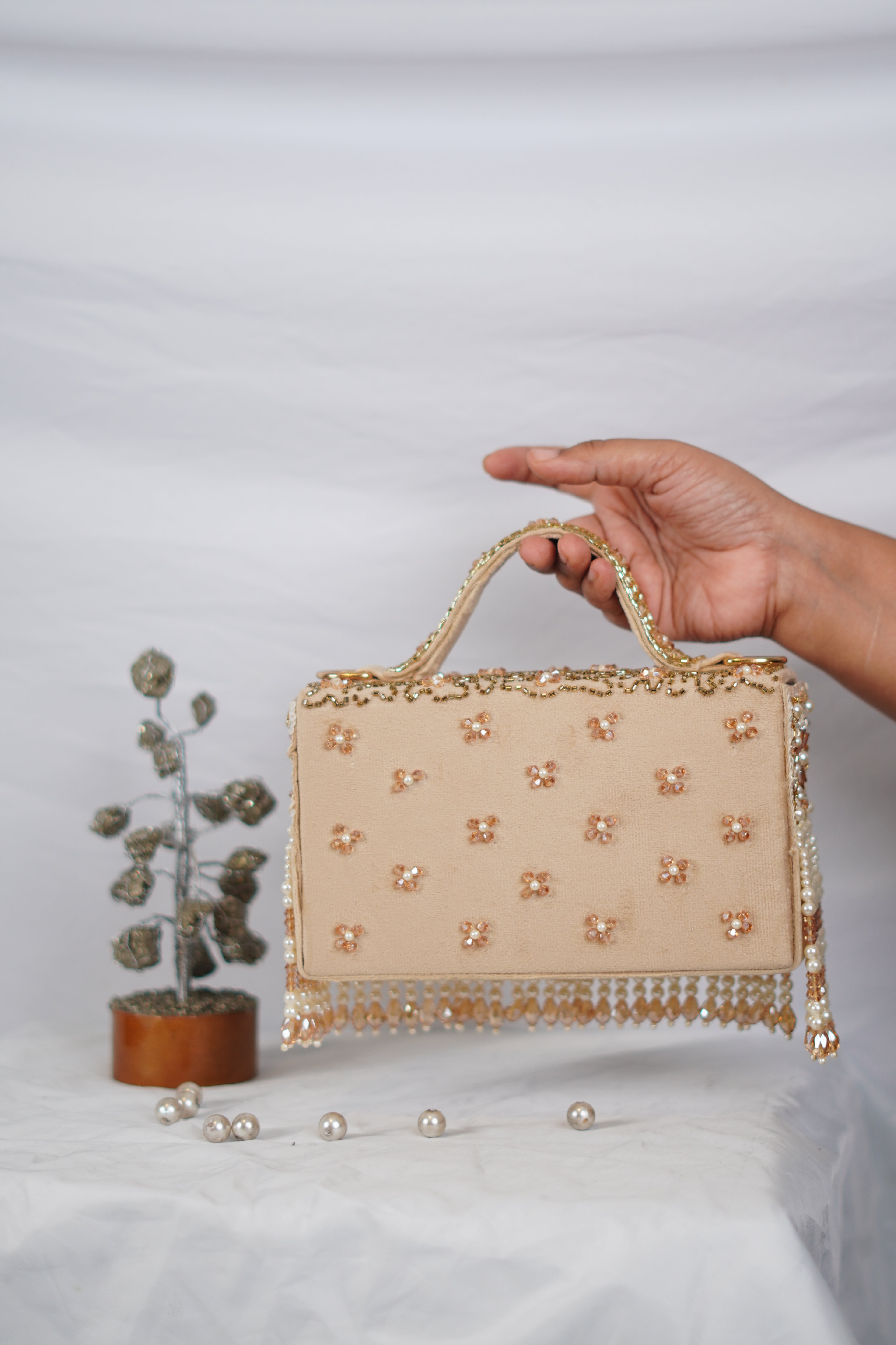 Partywear handbag with beaded tassels