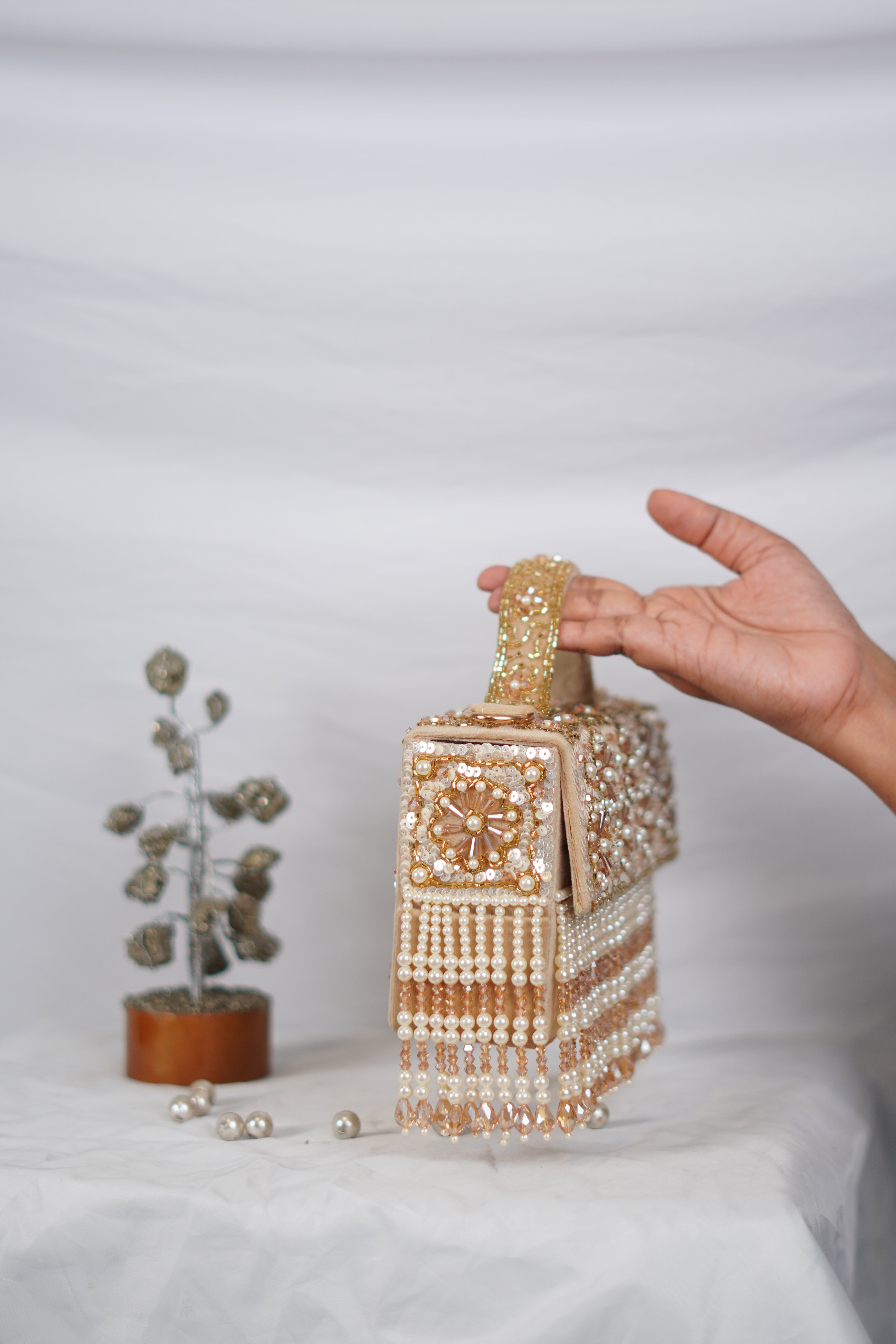 Partywear handbag with beaded tassels