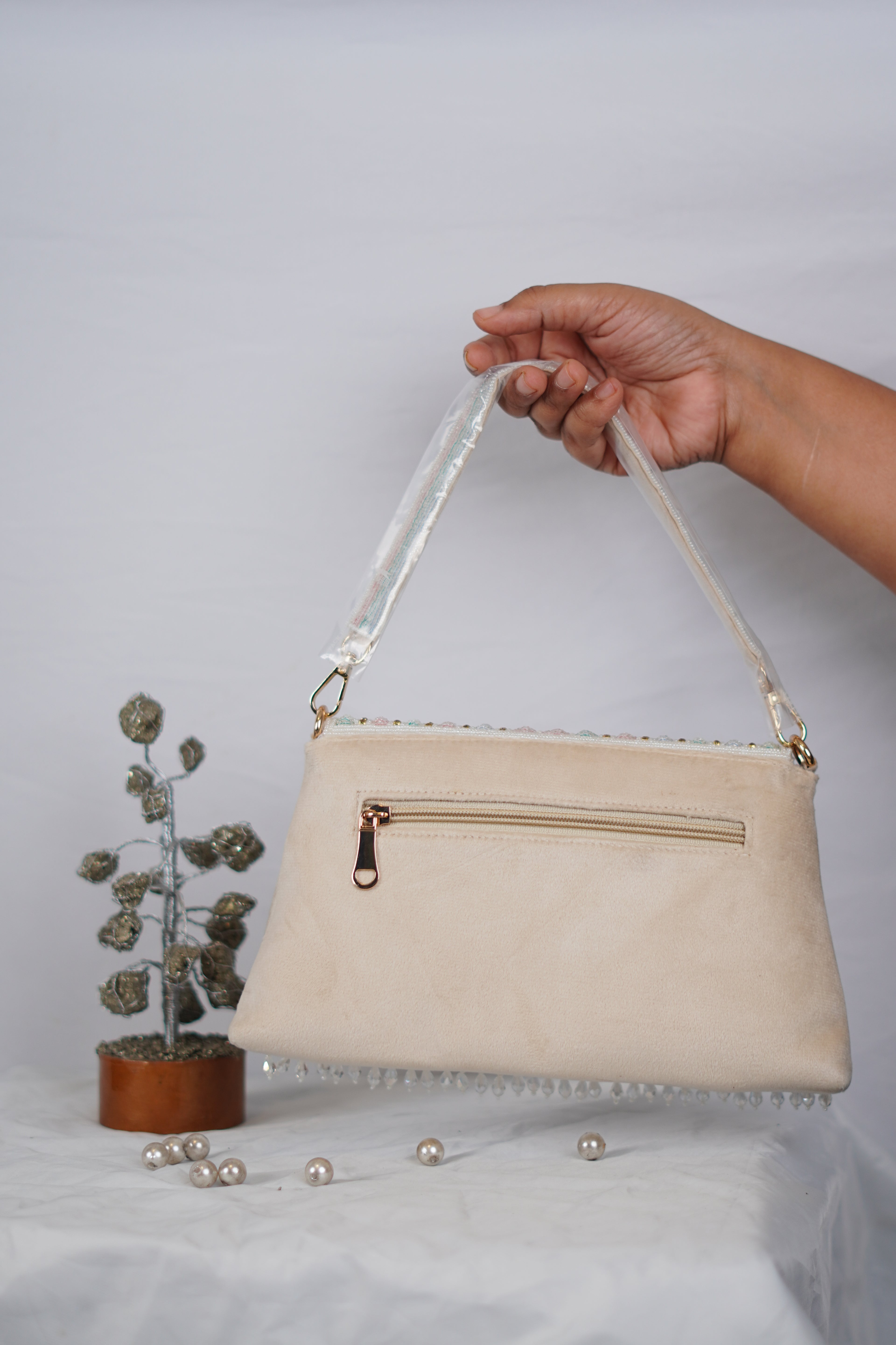 Partywear handbag with beaded tassels