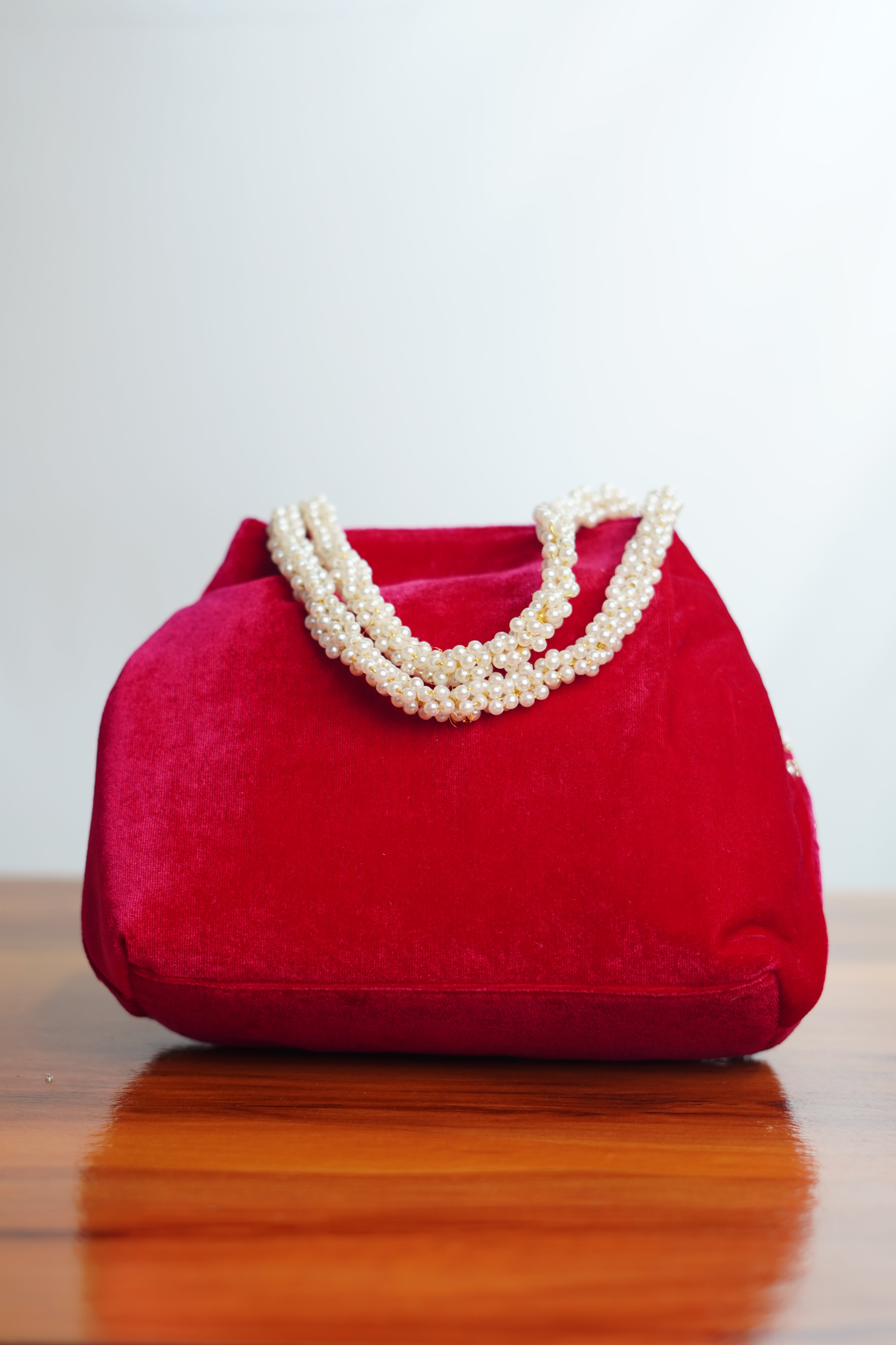 Velvet potli shaped party bags with beads