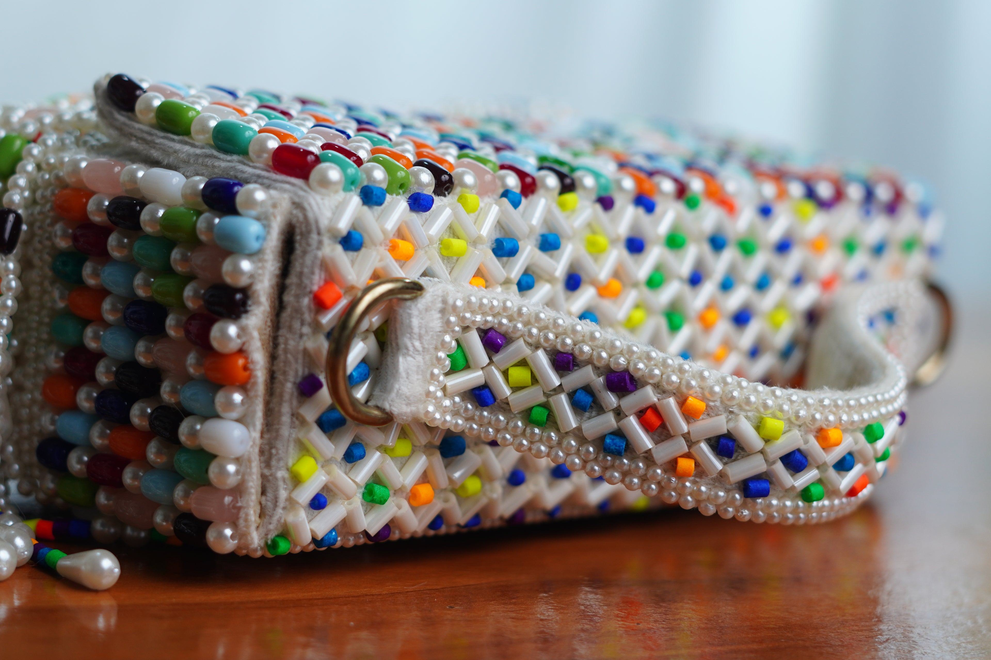 Multicolored white bag  with beaded tassels