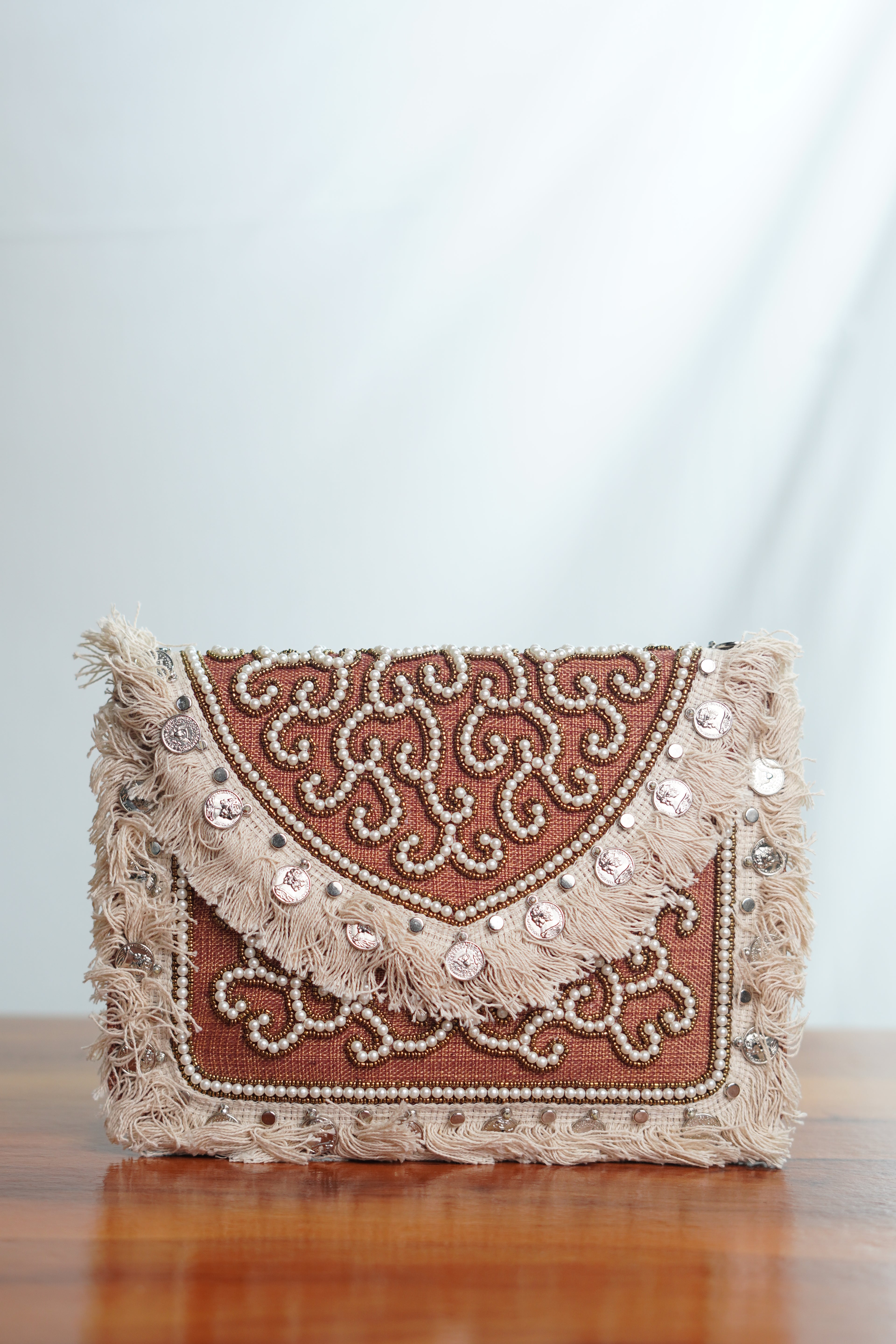 Jute clutch with tassels