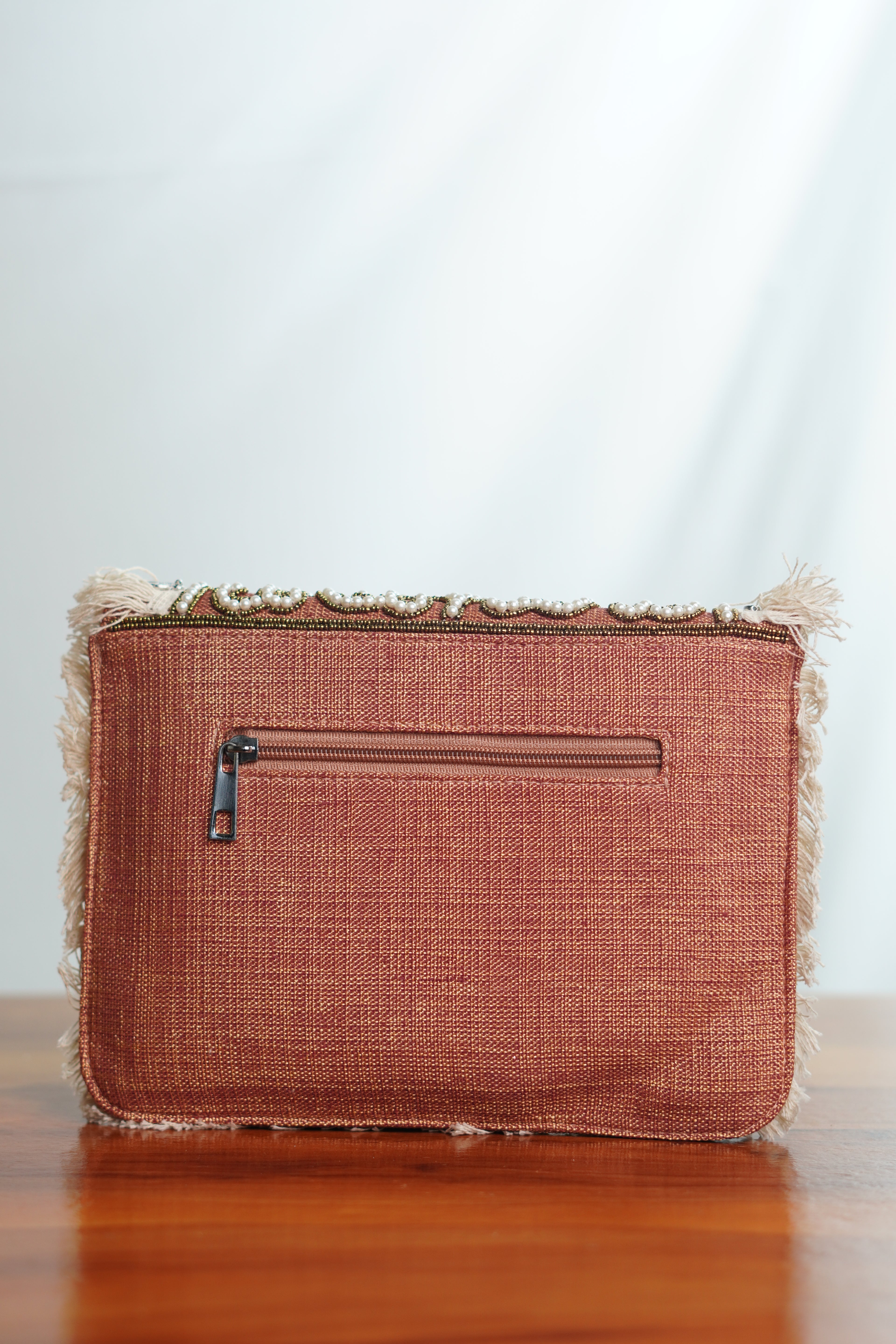 Jute clutch with tassels