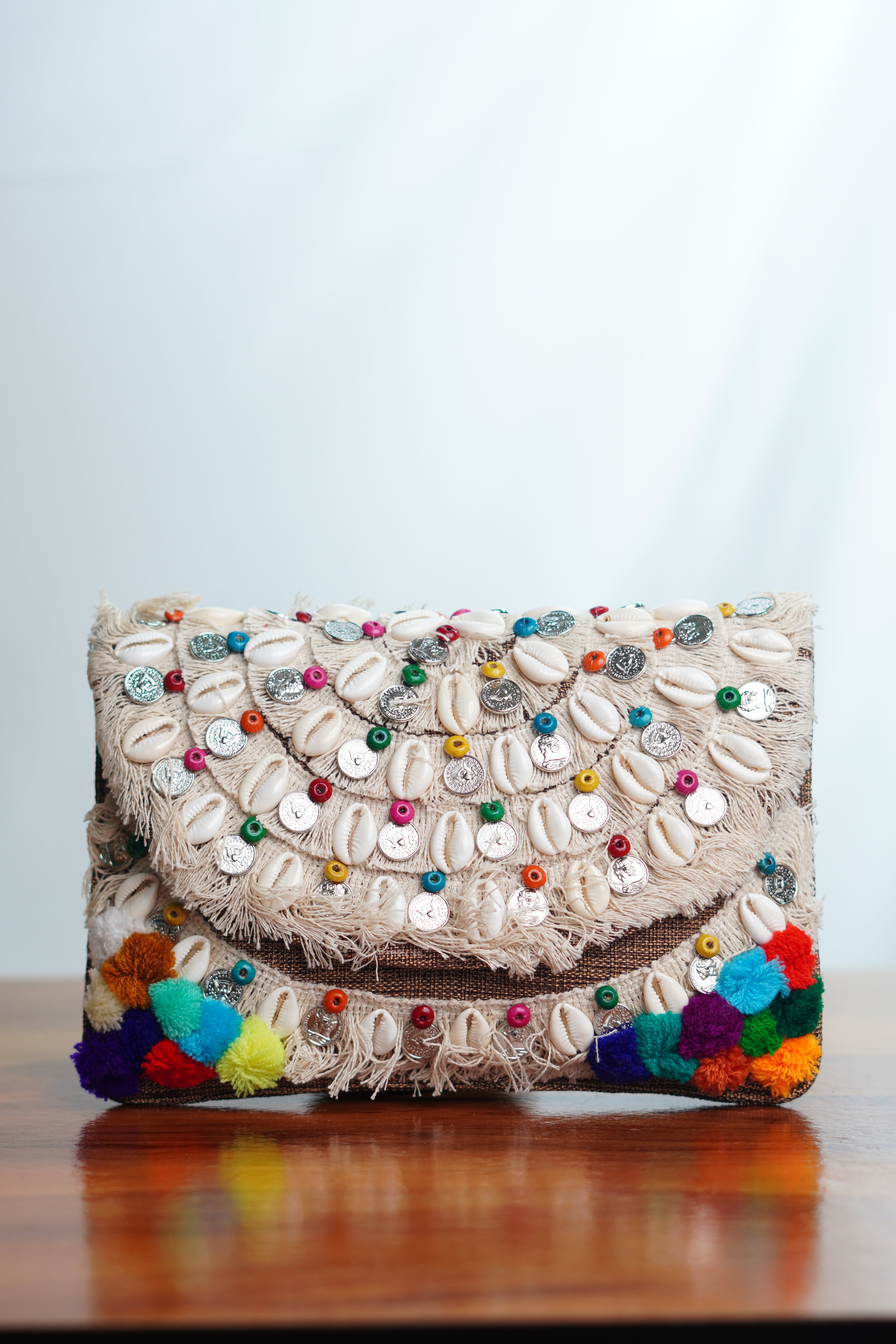 Jute clutch with shell work and tassels