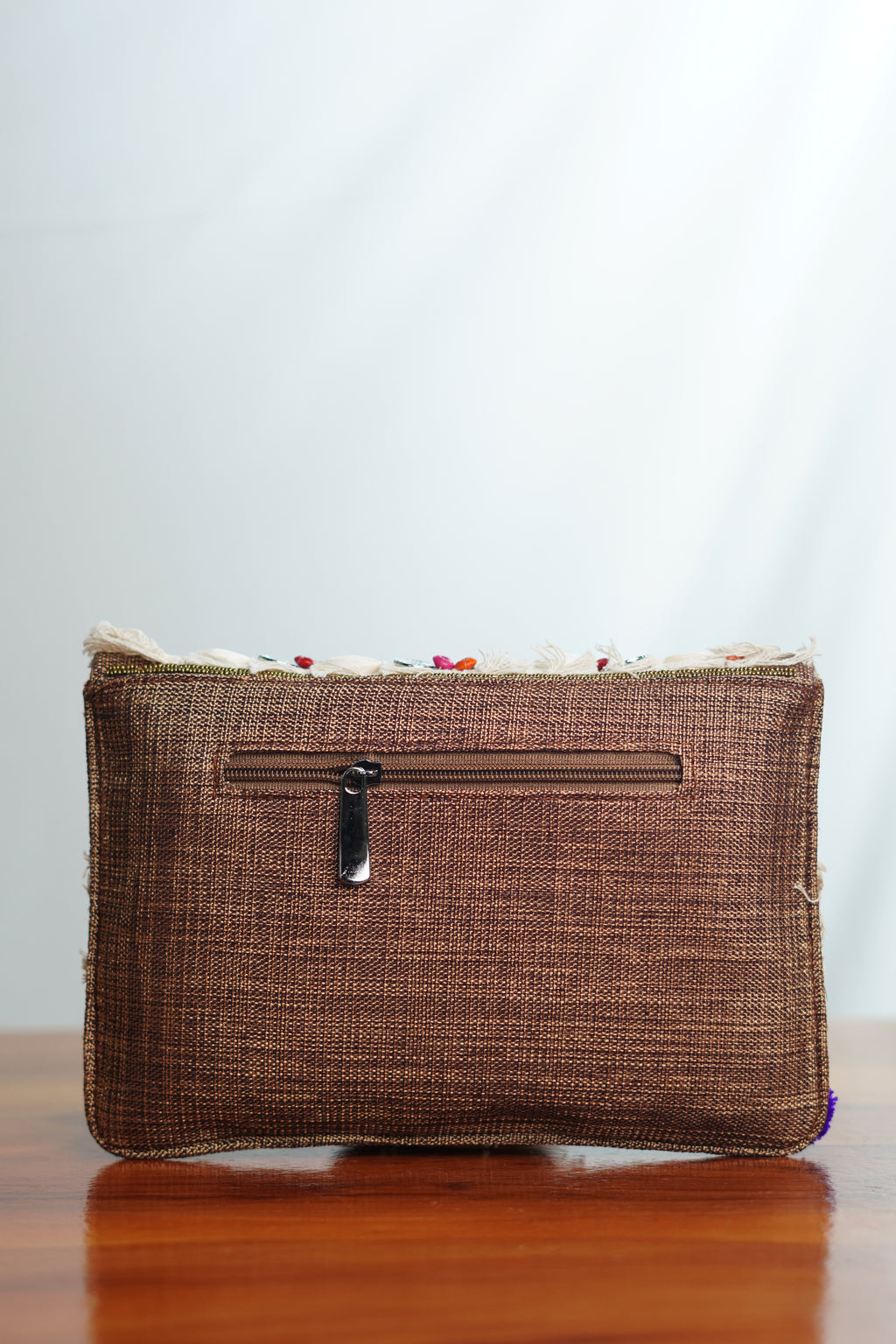 Jute clutch with shell work and tassels