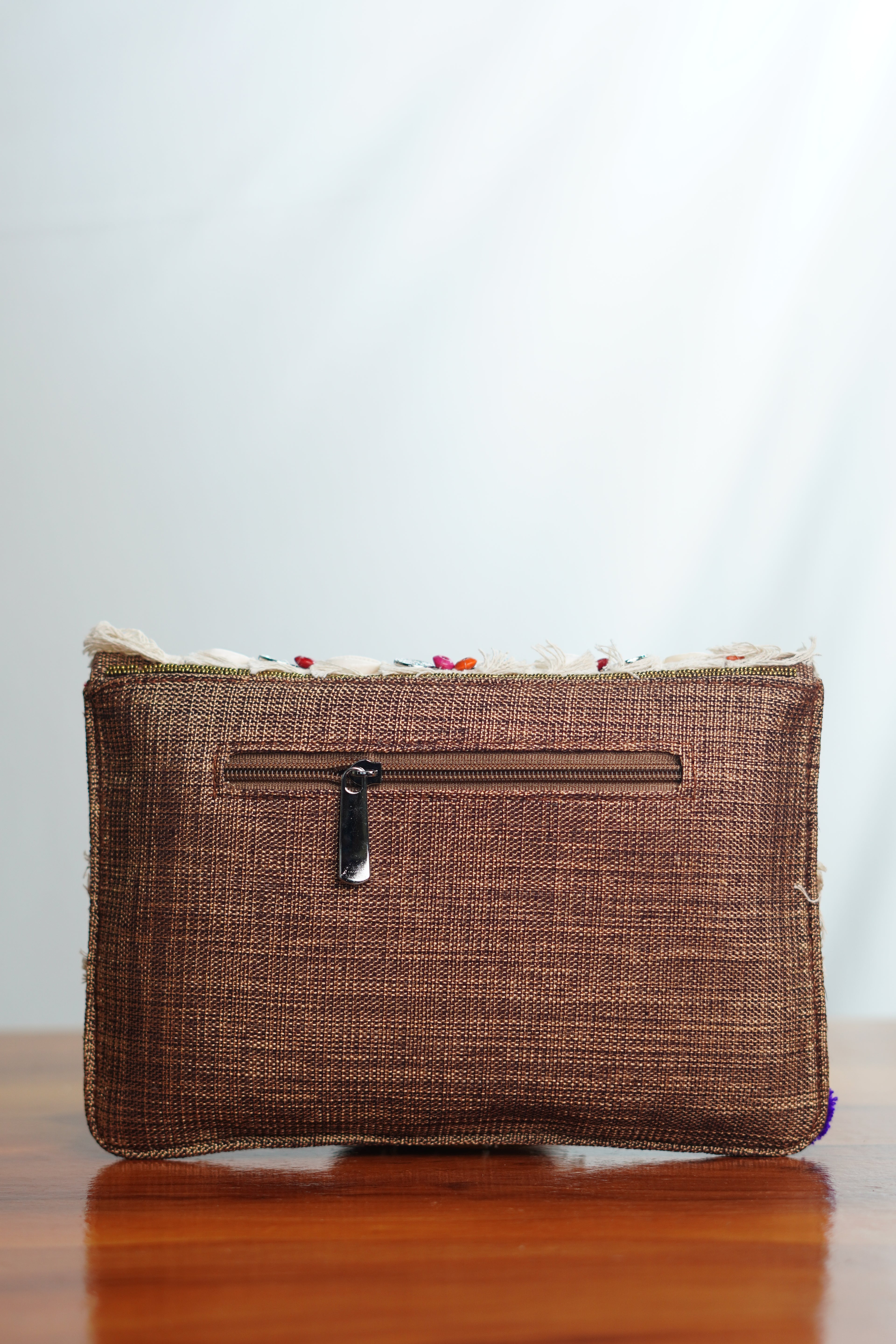 Jute clutch with shell work and tassels