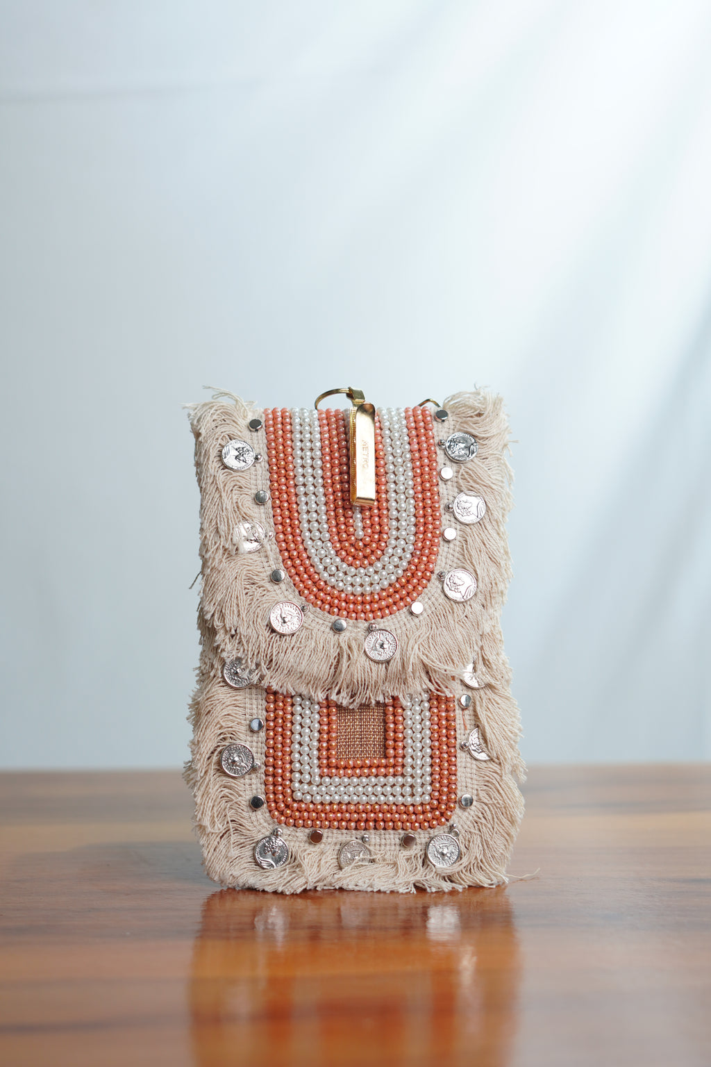 Saree clip mobile pouch with tassels, beige