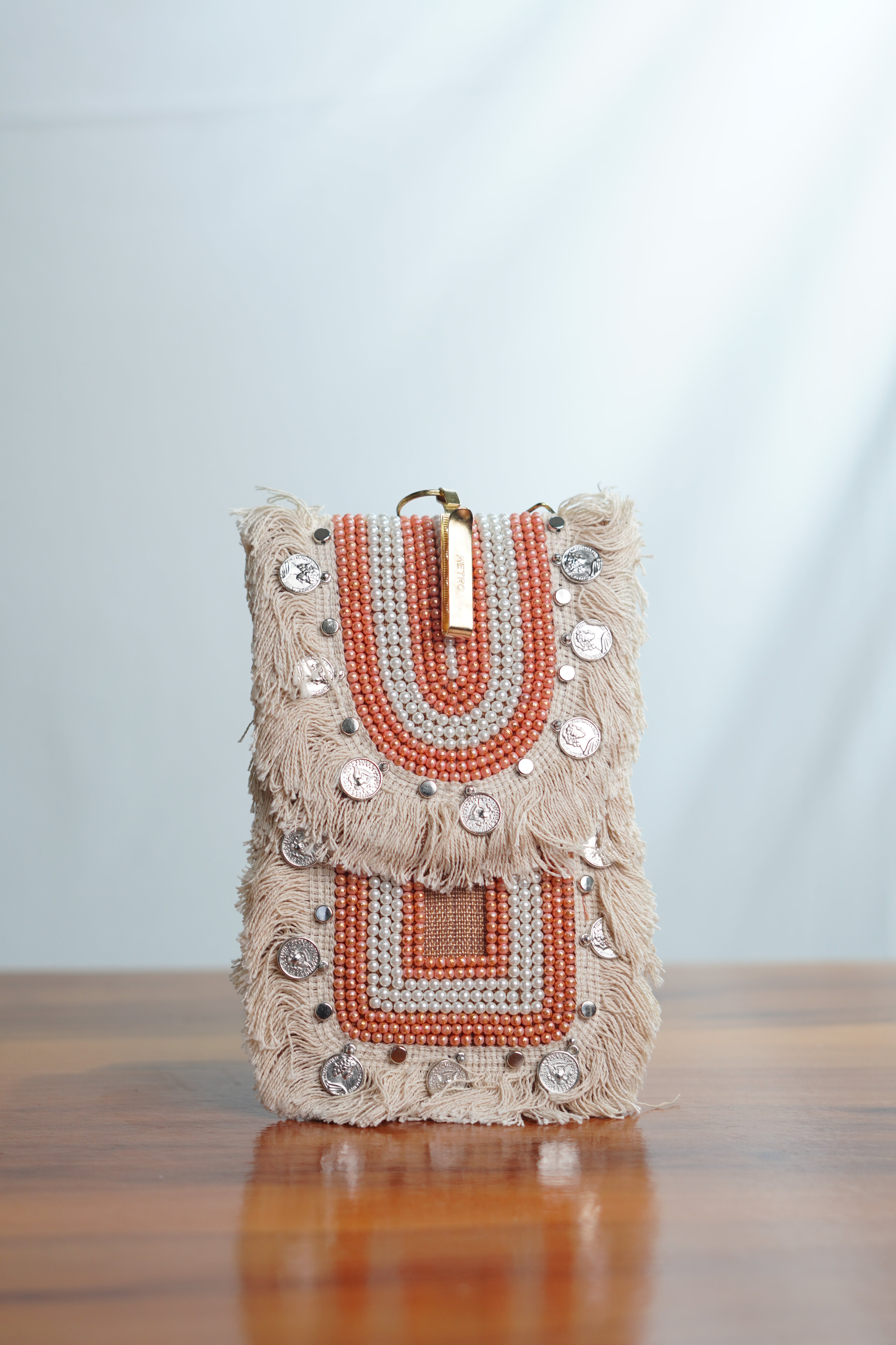 Saree clip mobile pouch with tassels, beige