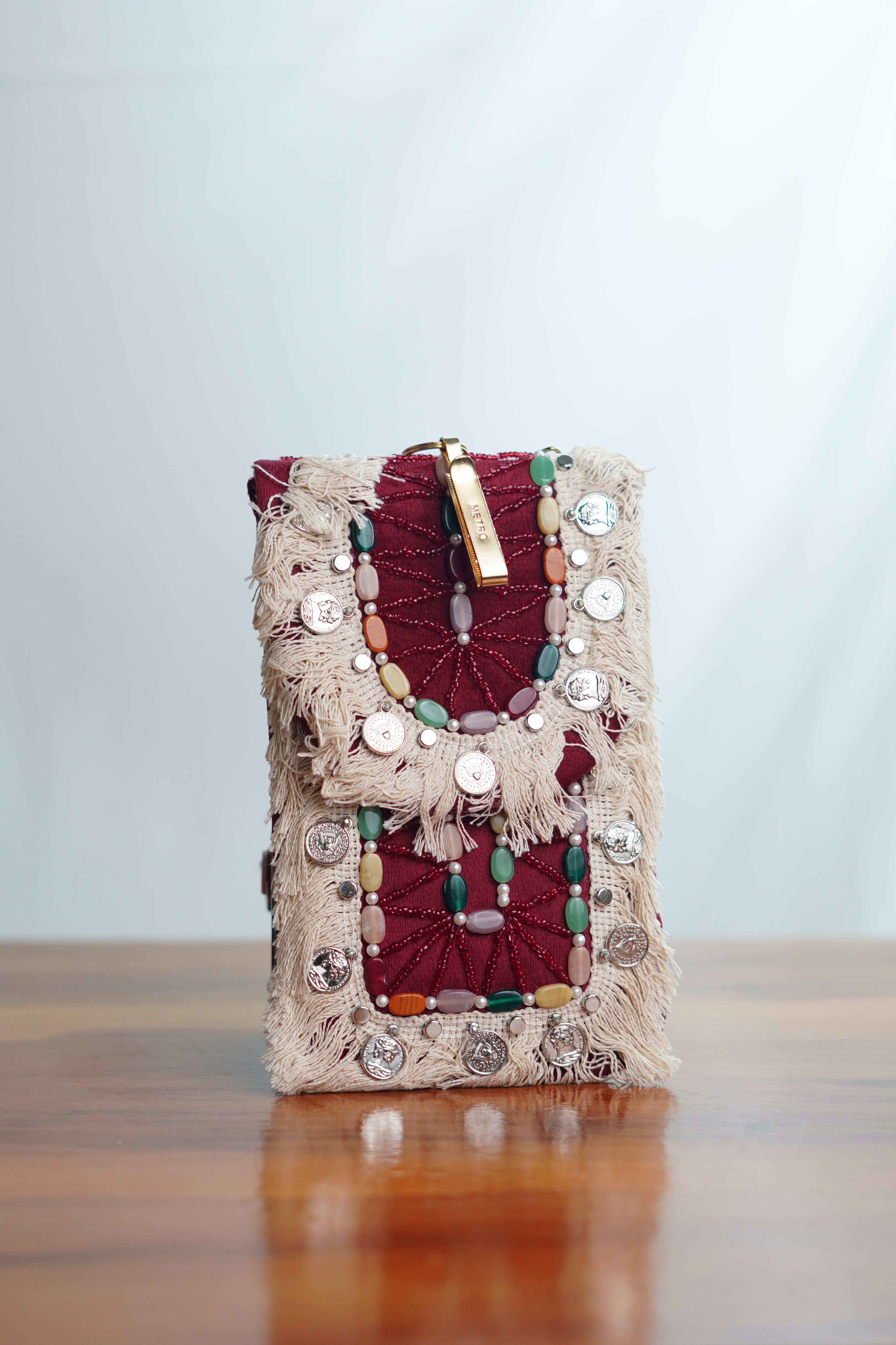 Saree clip mobile pouch with tassels, maroon