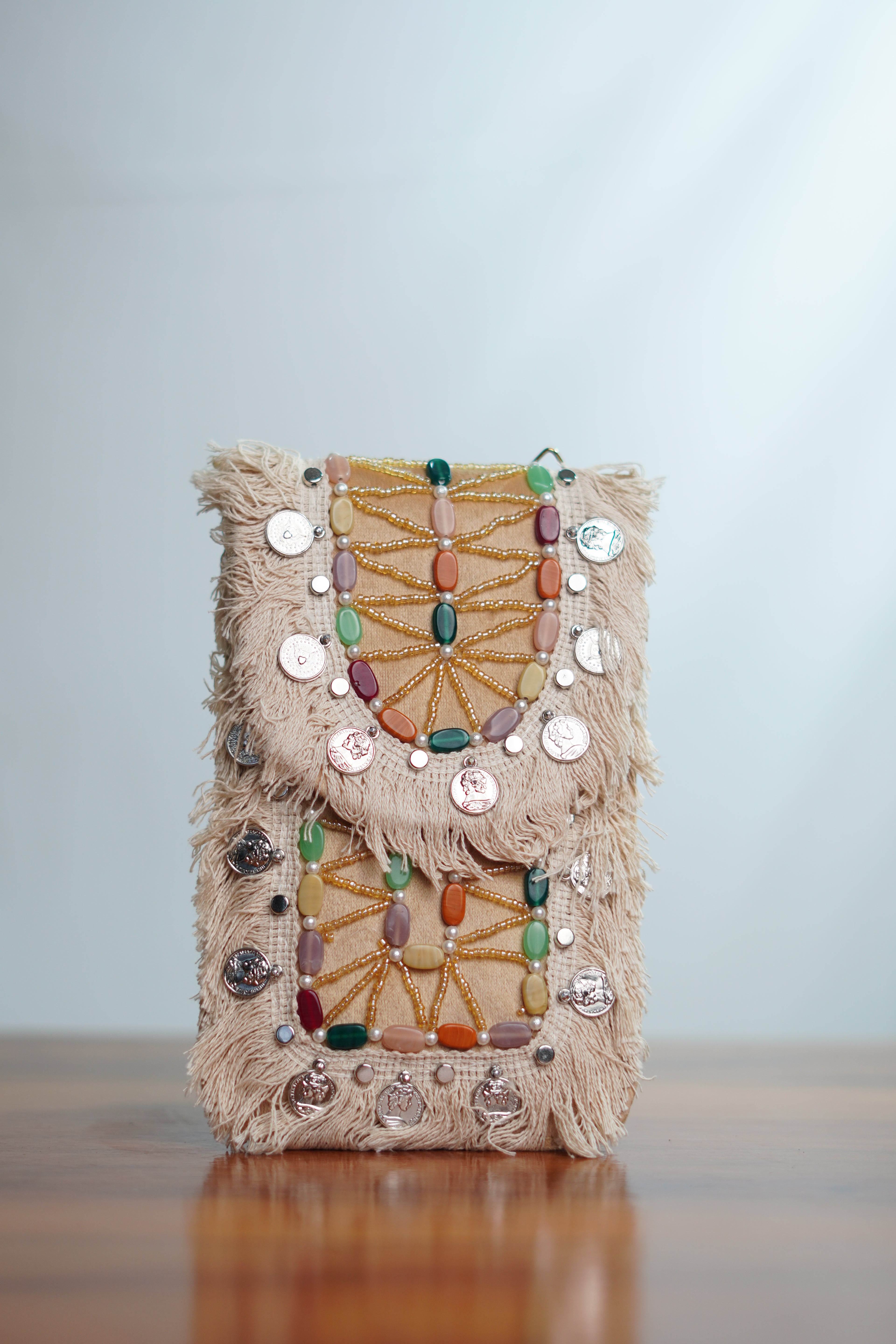 Saree clip mobile pouch with tassels, beige
