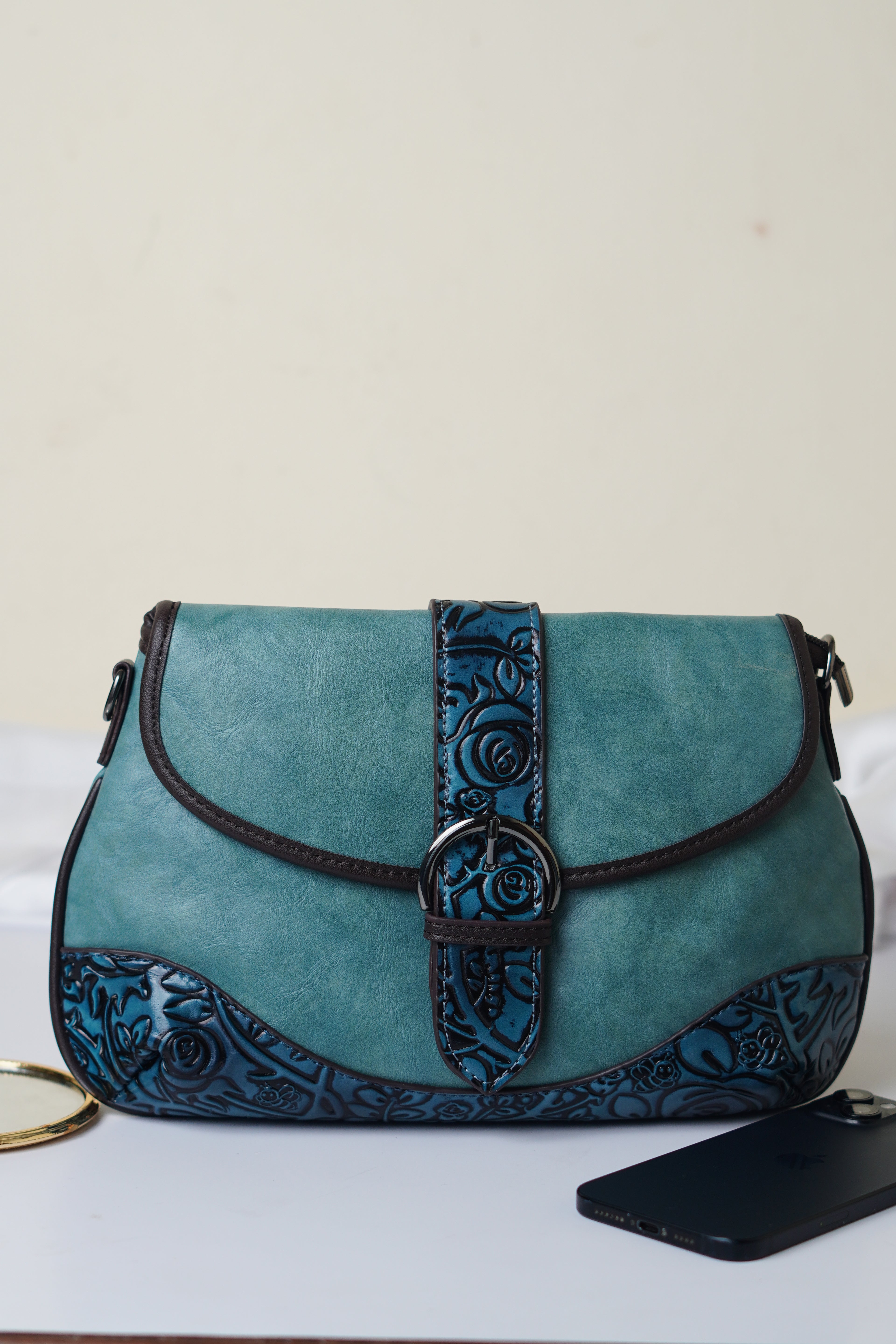 Teal sling bag