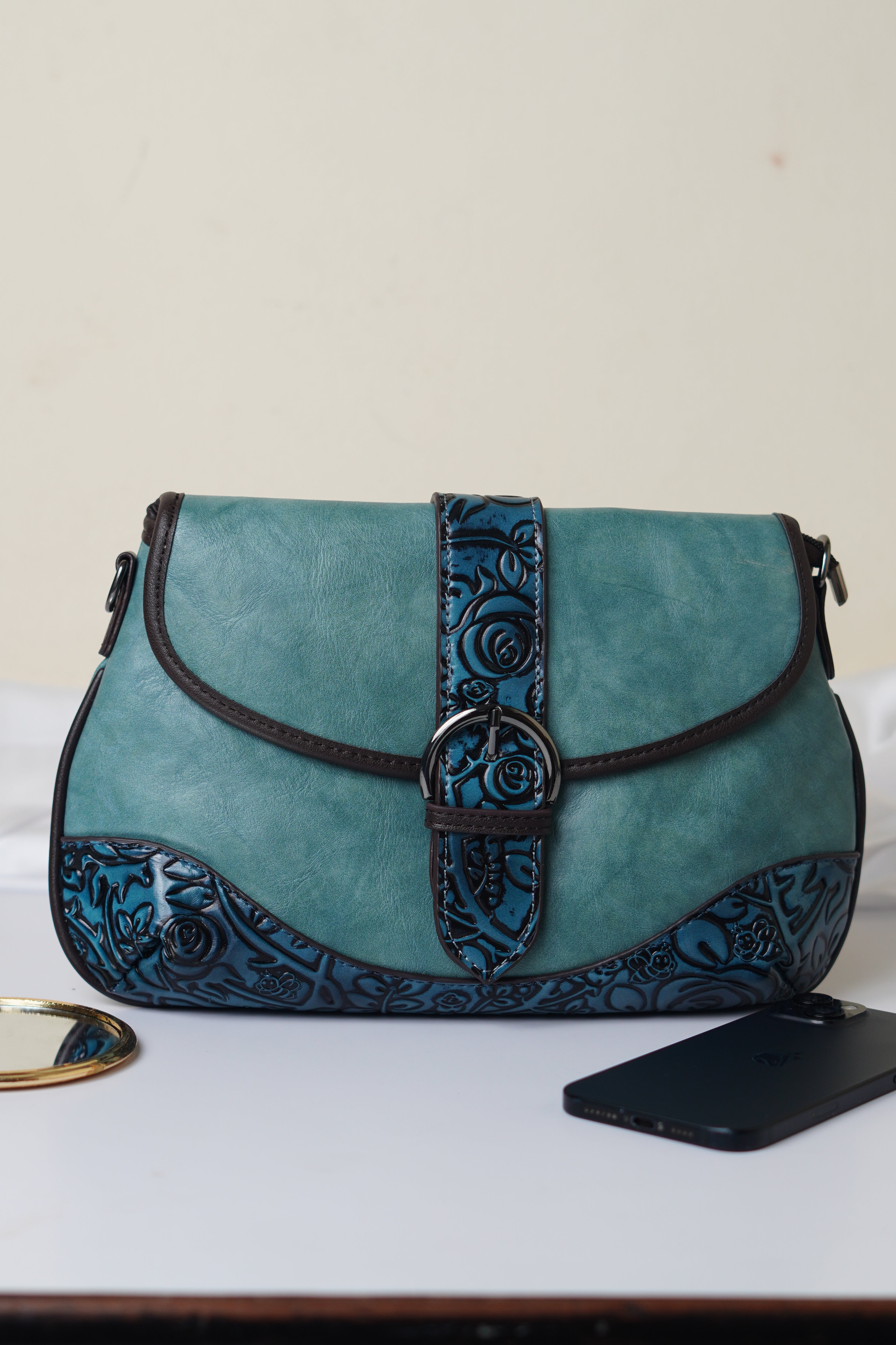 Teal sling bag