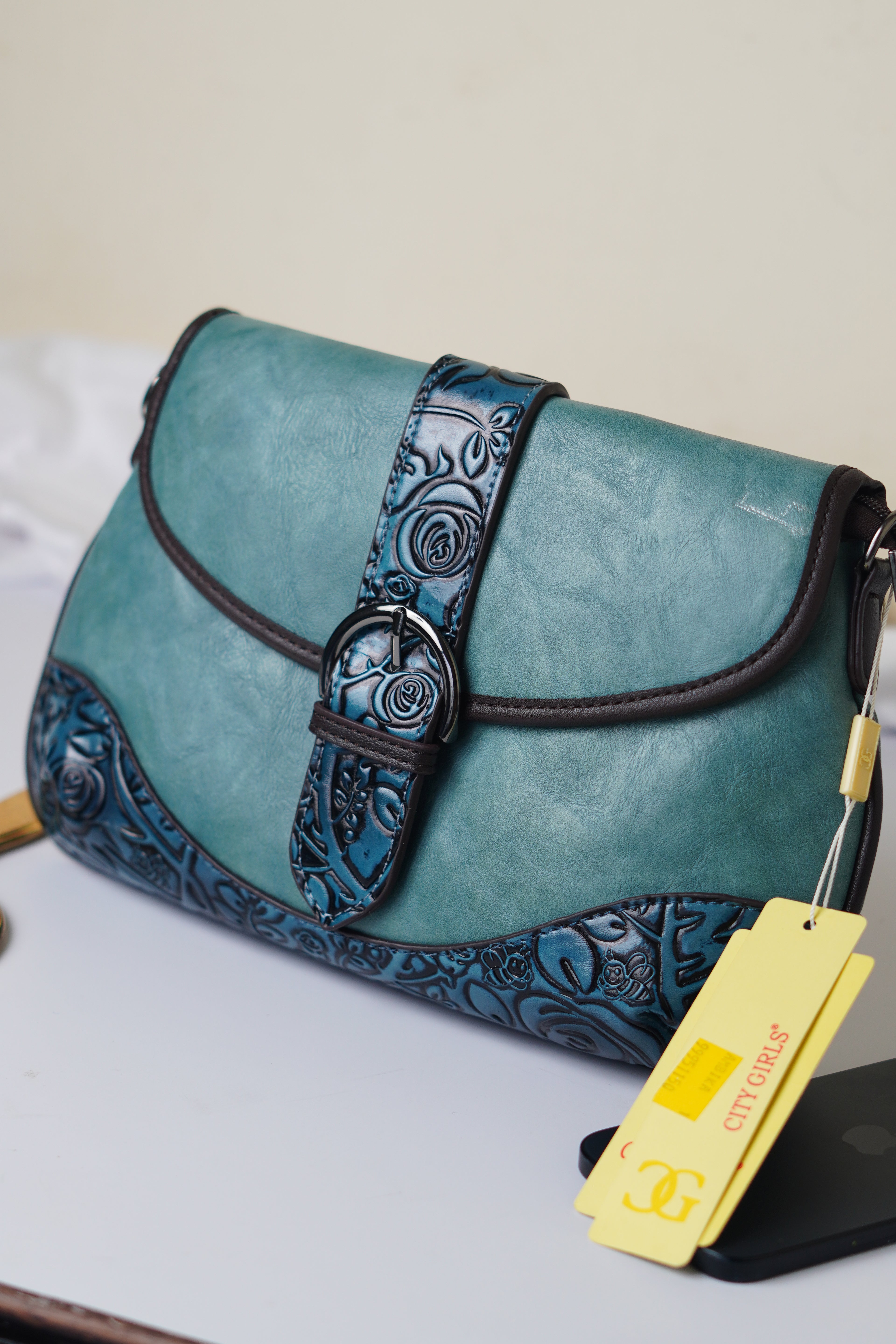 Teal sling bag