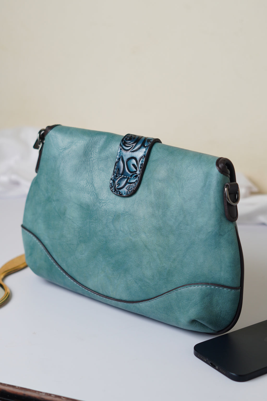 Teal sling bag