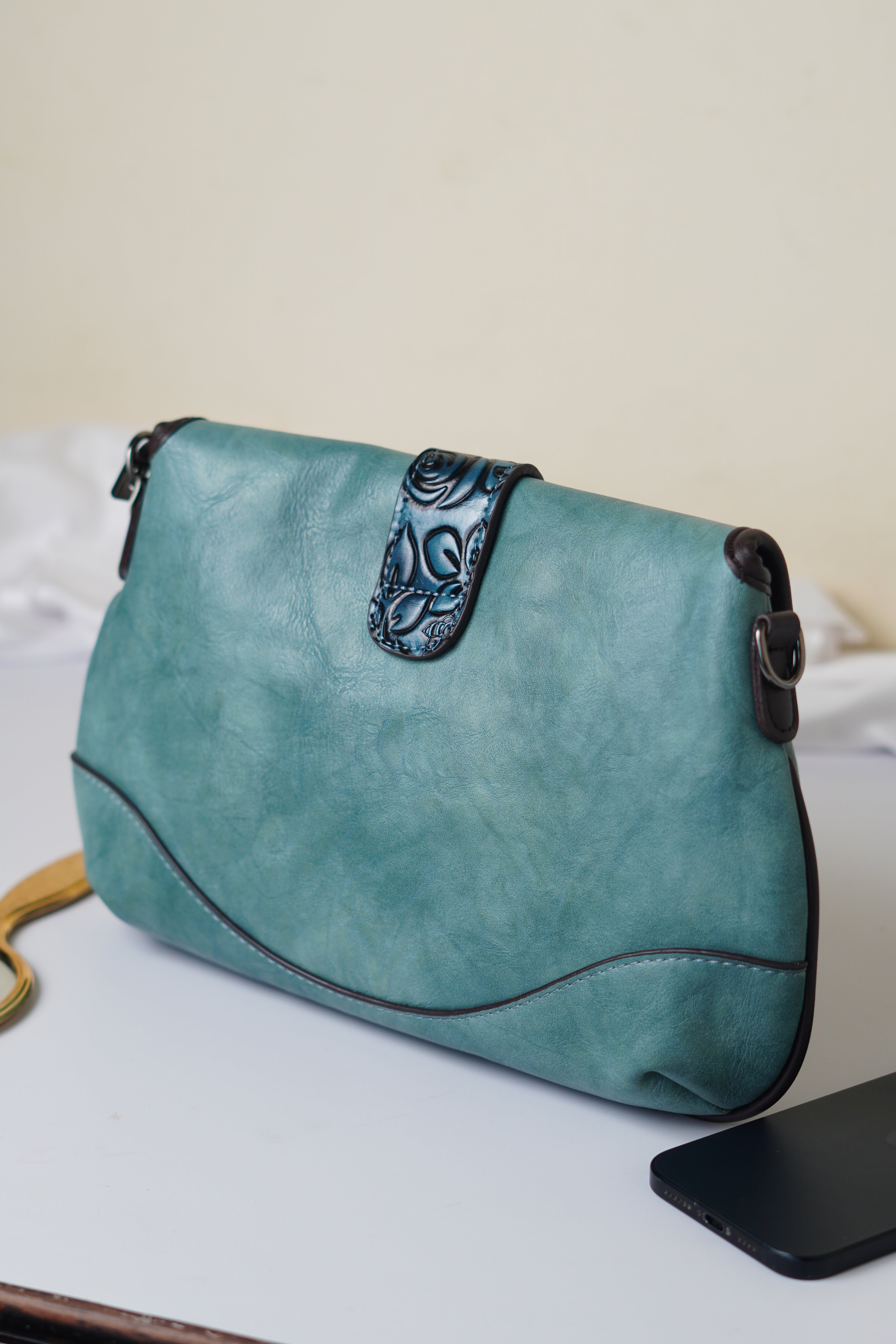 Teal sling bag